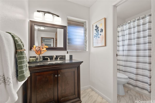 bathroom featuring a textured ceiling, toilet, and vanity