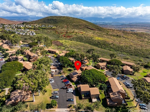 birds eye view of property with a mountain view