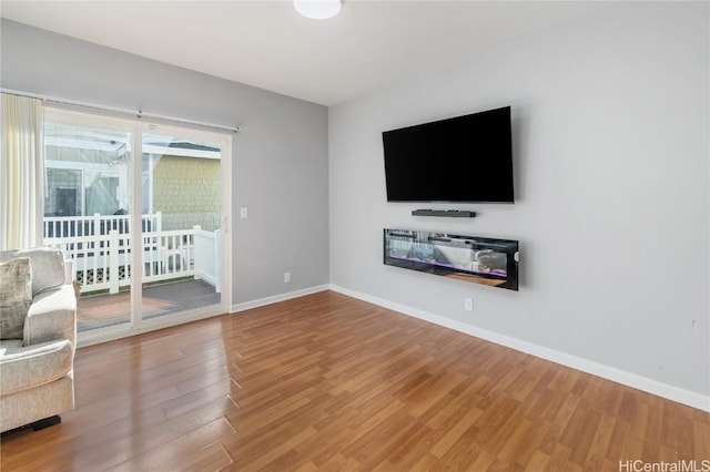 unfurnished living room with hardwood / wood-style floors