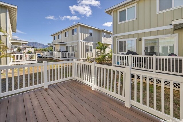 wooden deck with a mountain view