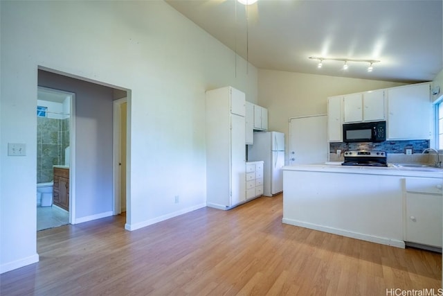 kitchen featuring light hardwood / wood-style floors, white refrigerator, white cabinetry, and stainless steel range with electric cooktop