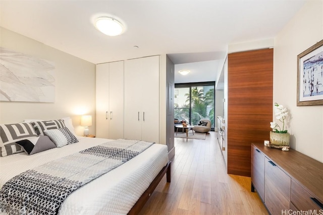 bedroom with light hardwood / wood-style floors