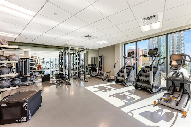 gym featuring a drop ceiling