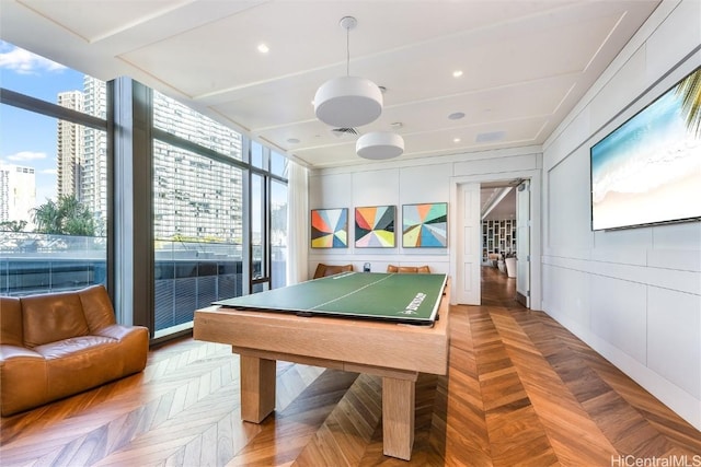 playroom featuring floor to ceiling windows and parquet flooring