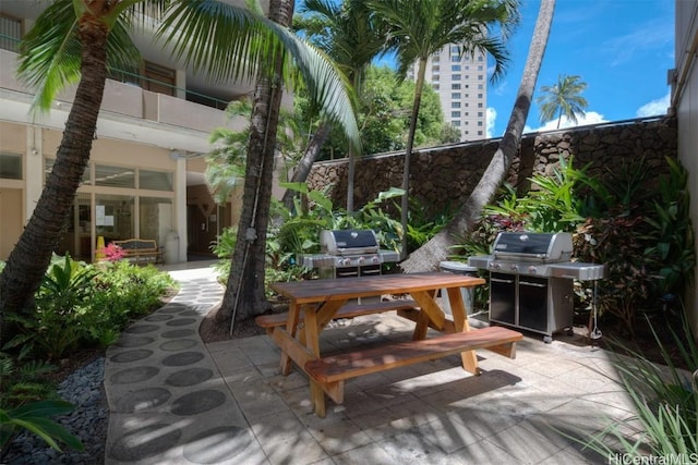 view of patio / terrace with a balcony and grilling area