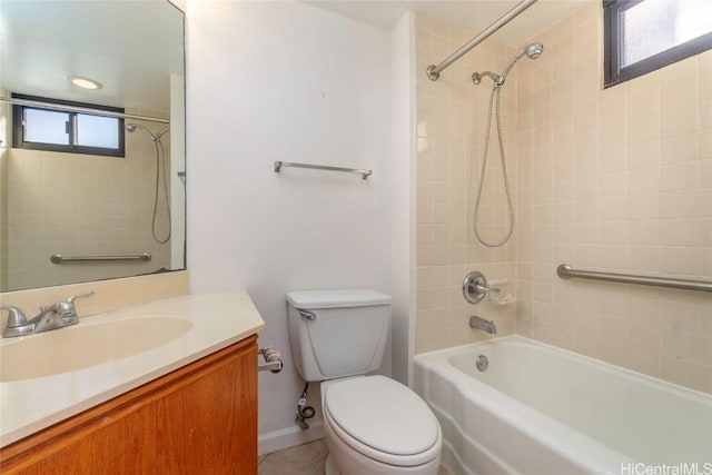 full bathroom featuring vanity, toilet, and tiled shower / bath