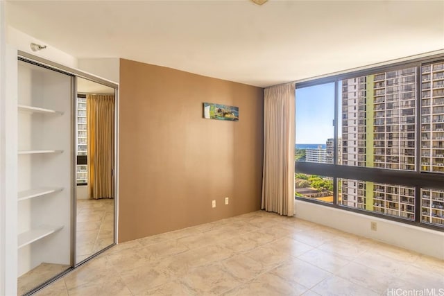 unfurnished bedroom featuring a closet