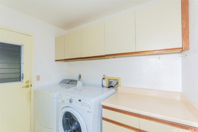 laundry area featuring cabinets and independent washer and dryer