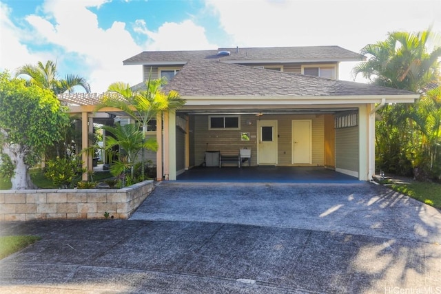 view of front of home with a carport