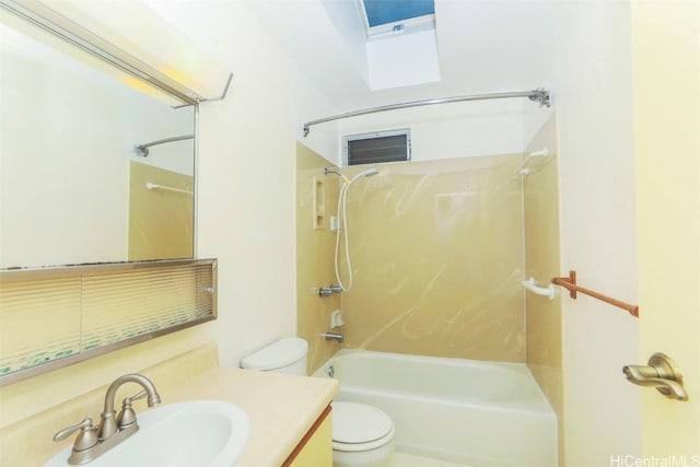 full bathroom with shower / bathing tub combination, vanity, toilet, and a skylight