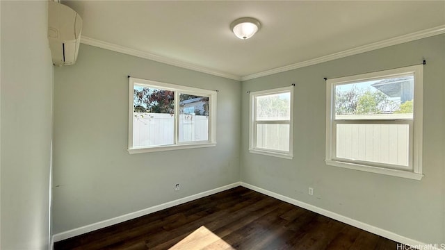 empty room featuring crown molding, dark wood-type flooring, and a wall mounted air conditioner