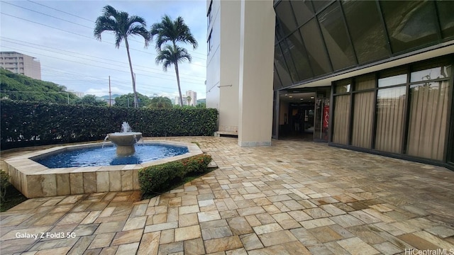 view of swimming pool featuring pool water feature