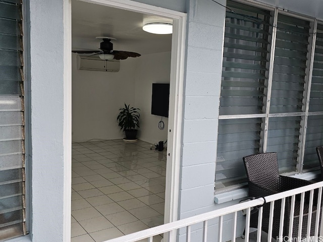 view of exterior entry featuring an AC wall unit and ceiling fan