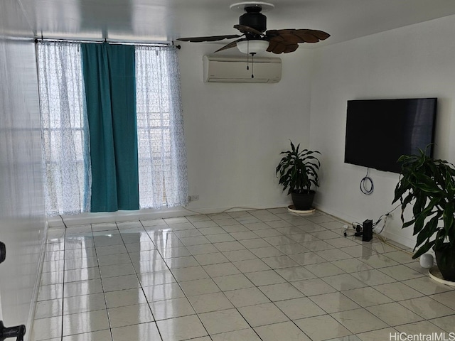 unfurnished living room featuring ceiling fan, a wall mounted AC, and light tile patterned flooring