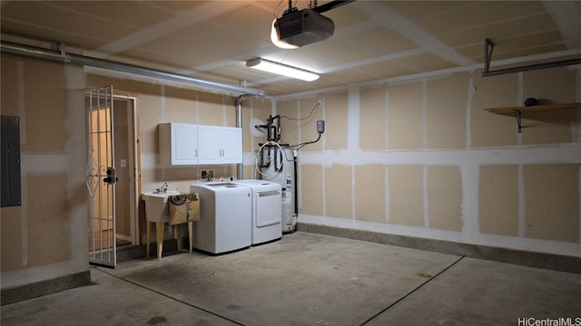 interior space with electric panel, a garage door opener, and washing machine and clothes dryer