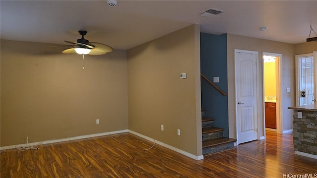 interior space with dark hardwood / wood-style flooring and ceiling fan