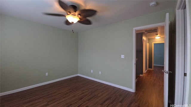 unfurnished room featuring ceiling fan and dark wood-type flooring