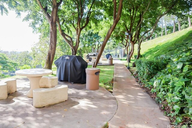 view of patio featuring a grill