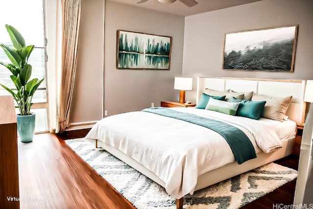 bedroom featuring wood-type flooring and ceiling fan