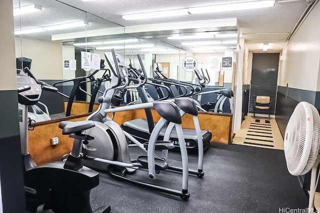 workout area featuring a textured ceiling