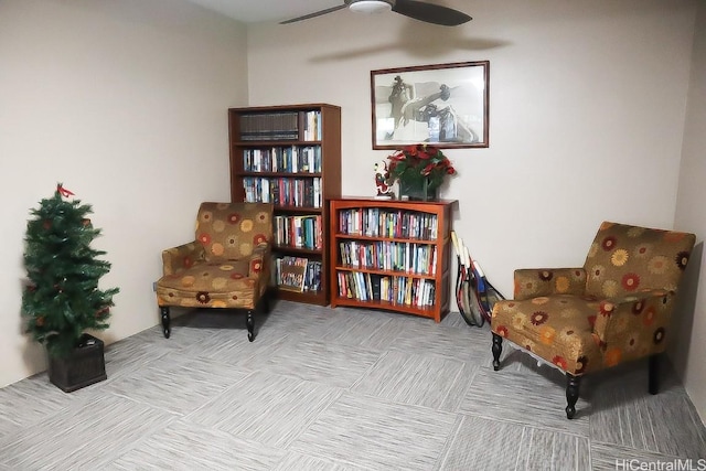 living area featuring ceiling fan