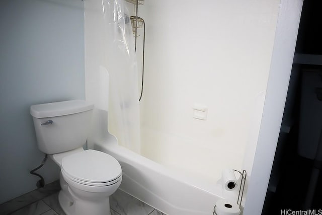 bathroom with shower / tub combo with curtain and toilet