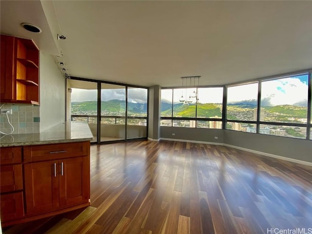 interior space featuring a mountain view and dark wood-type flooring