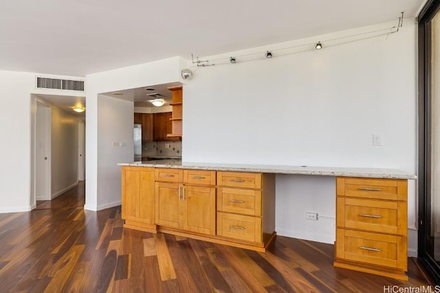 kitchen with built in desk, visible vents, open shelves, and dark wood finished floors