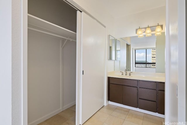 bathroom featuring tile patterned flooring and vanity