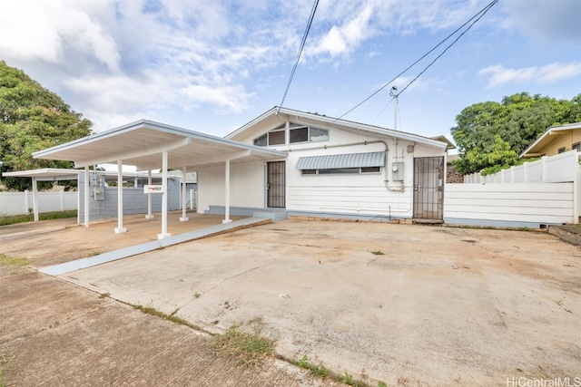 view of front of property with a carport