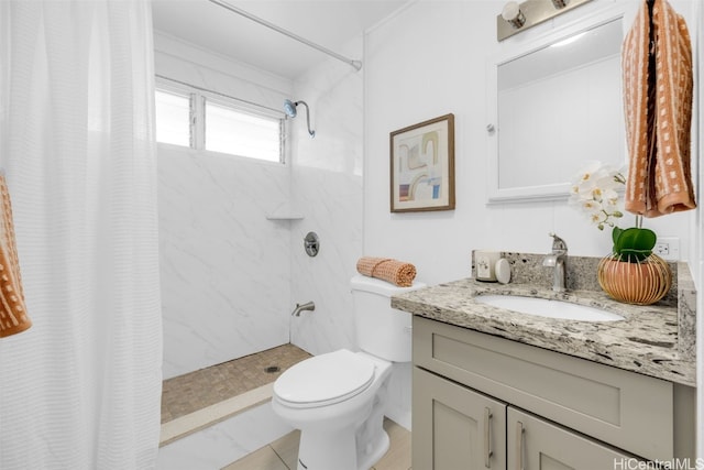 bathroom with vanity, toilet, and walk in shower