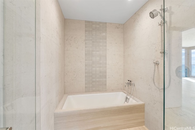 bathroom with separate shower and tub