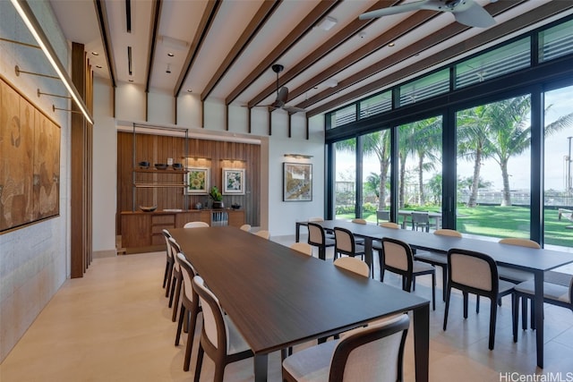 dining room featuring ceiling fan and a high ceiling