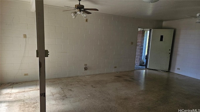 unfurnished room with a textured ceiling