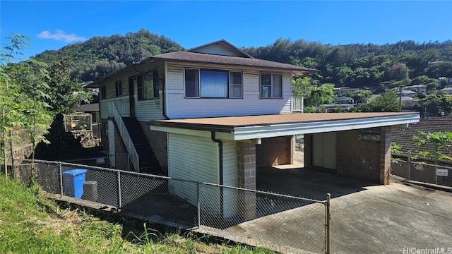 exterior space featuring a carport