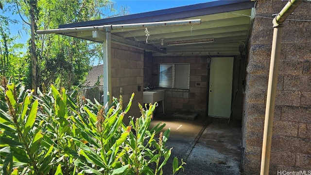 exterior space with a carport