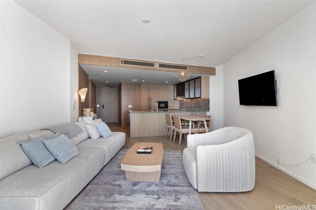 living room featuring light wood-type flooring