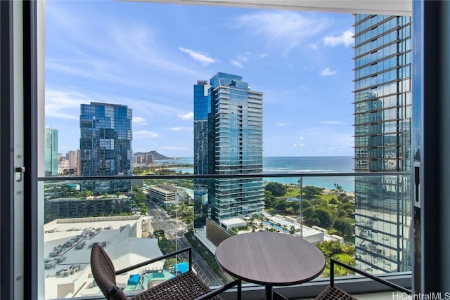 balcony featuring a water view