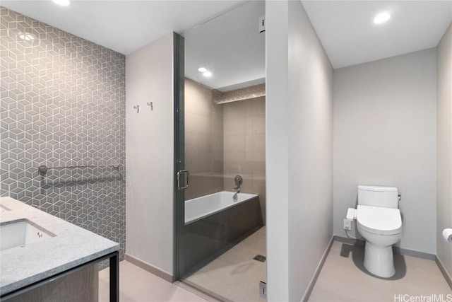 full bathroom featuring plus walk in shower, tile patterned flooring, toilet, vanity, and tile walls