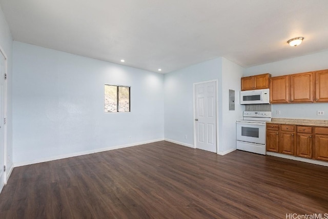 kitchen with electric panel, dark hardwood / wood-style floors, and white appliances