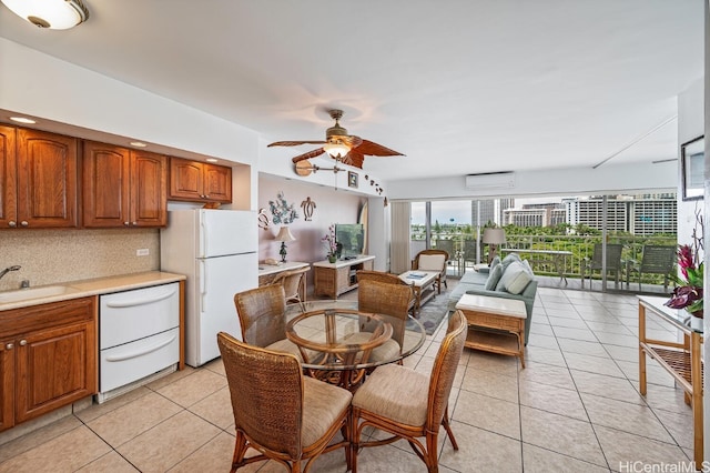 kitchen with white appliances, backsplash, sink, ceiling fan, and light tile patterned floors