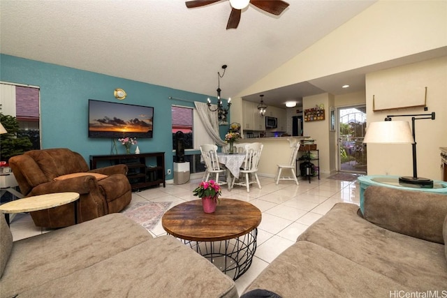 tiled living room featuring a textured ceiling, vaulted ceiling, and ceiling fan