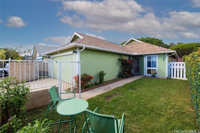 exterior space with a lawn and a garage