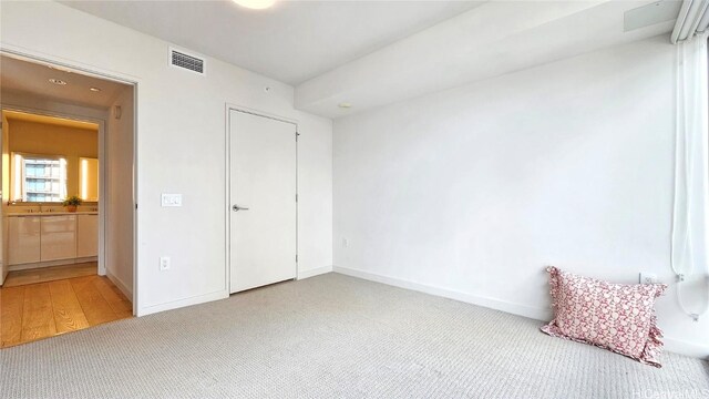 unfurnished bedroom with carpet flooring