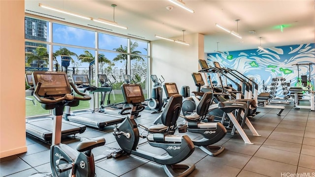 exercise room with floor to ceiling windows