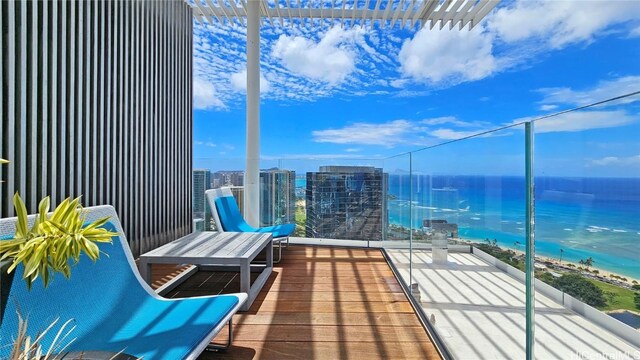 balcony featuring a water view