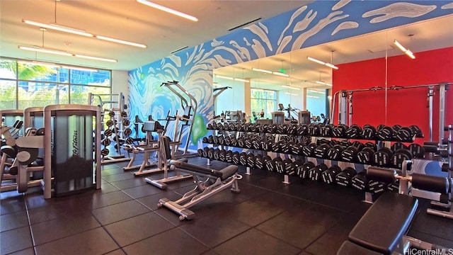 gym with a wall of windows and plenty of natural light