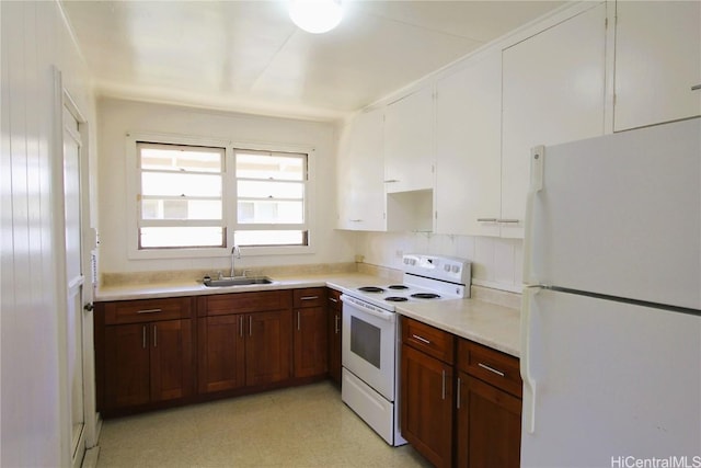 kitchen featuring sink and white appliances