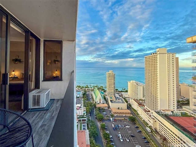 balcony with cooling unit and a water view