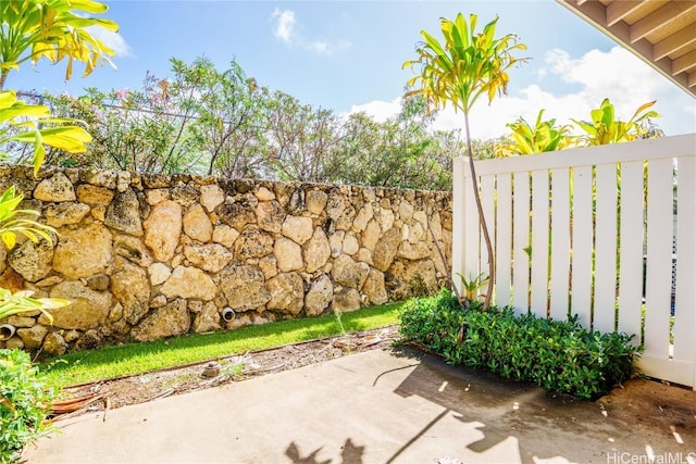 view of patio / terrace featuring fence